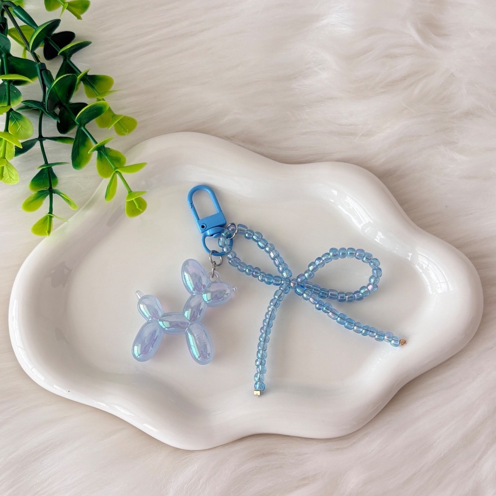 Iridescent Blue Balloon Dog Keychain with Beaded Bow Charm Accessory
